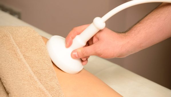 Woman gets therapy treatment at spa salon